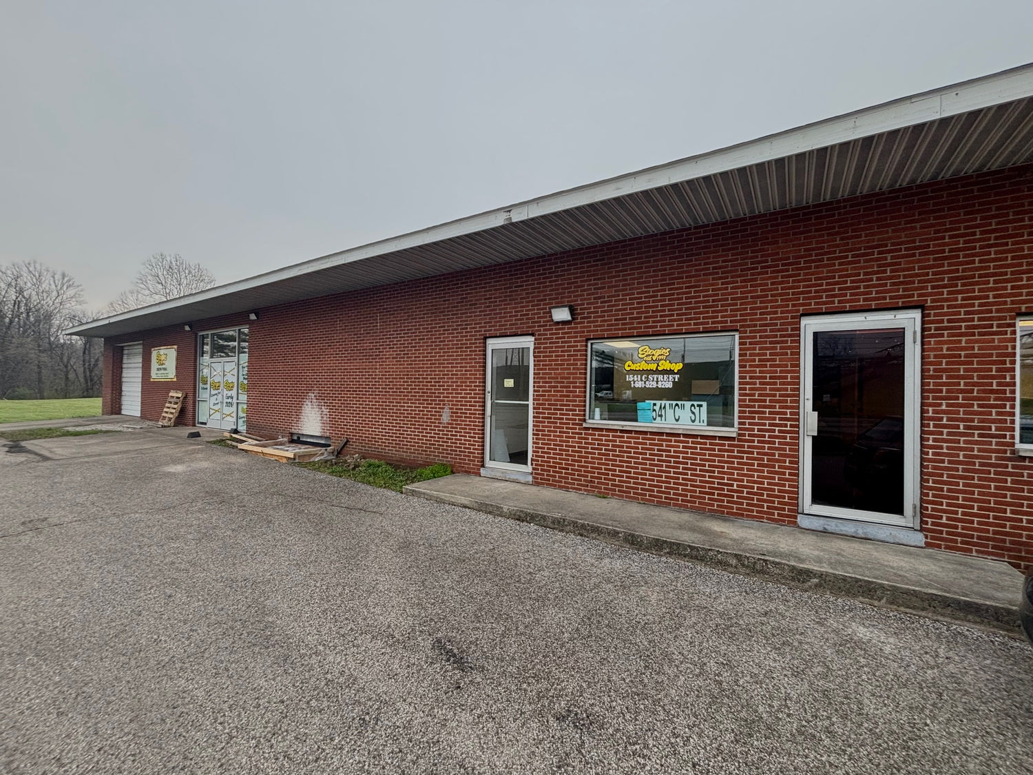 Brick building with a sign on the side, exterior view